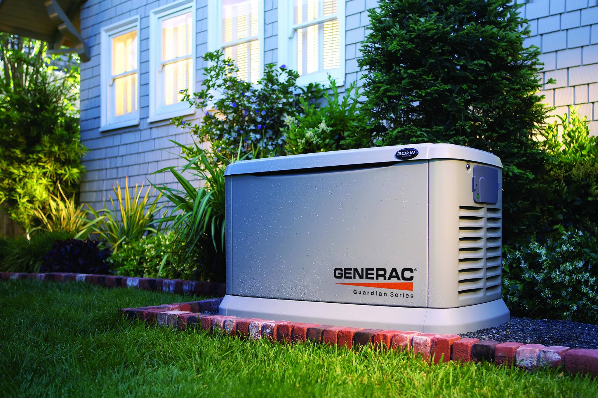 Generac Generator outside of a house ready to backup power