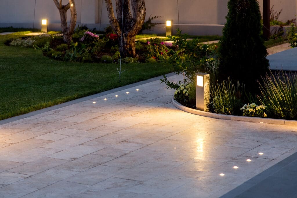 Driveway illuminated by Landscape lighting